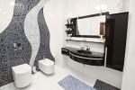 Baño modernista con lavabo negro