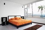 Dormitorio de estilo ecléctico con color naranja